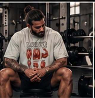 Lifter sitting on a bench in the LGBTQ tee